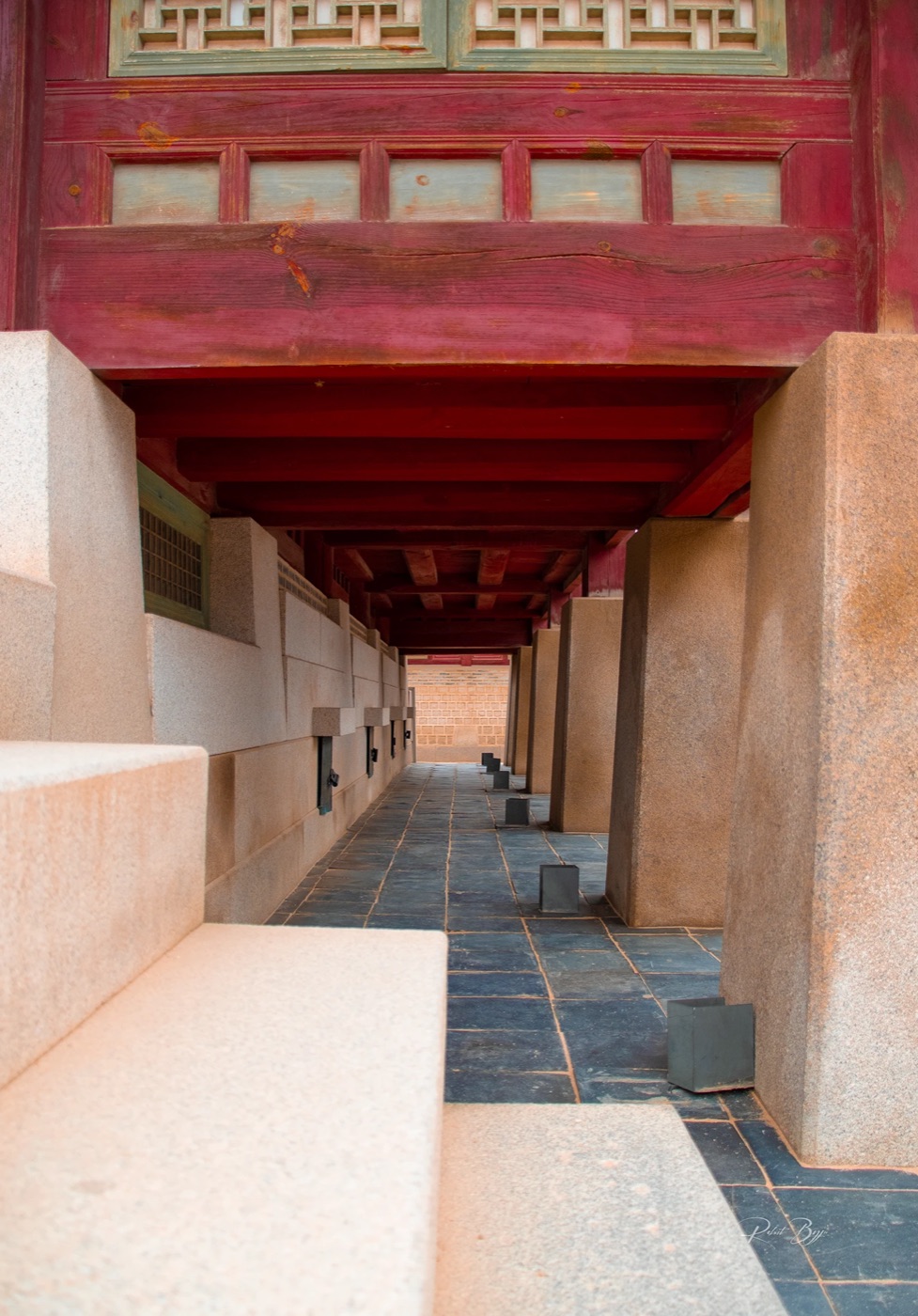 Red palace corridor in soft light