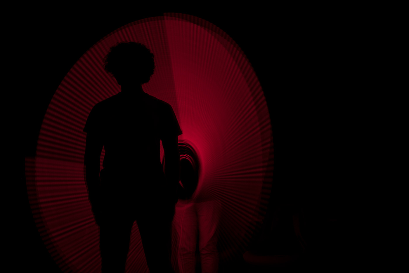 Silhouette inside a red light-painted circle