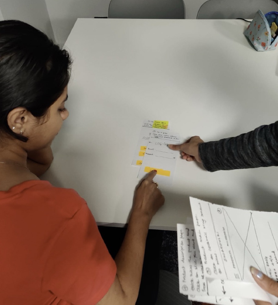 A participant testing the paper prototype
