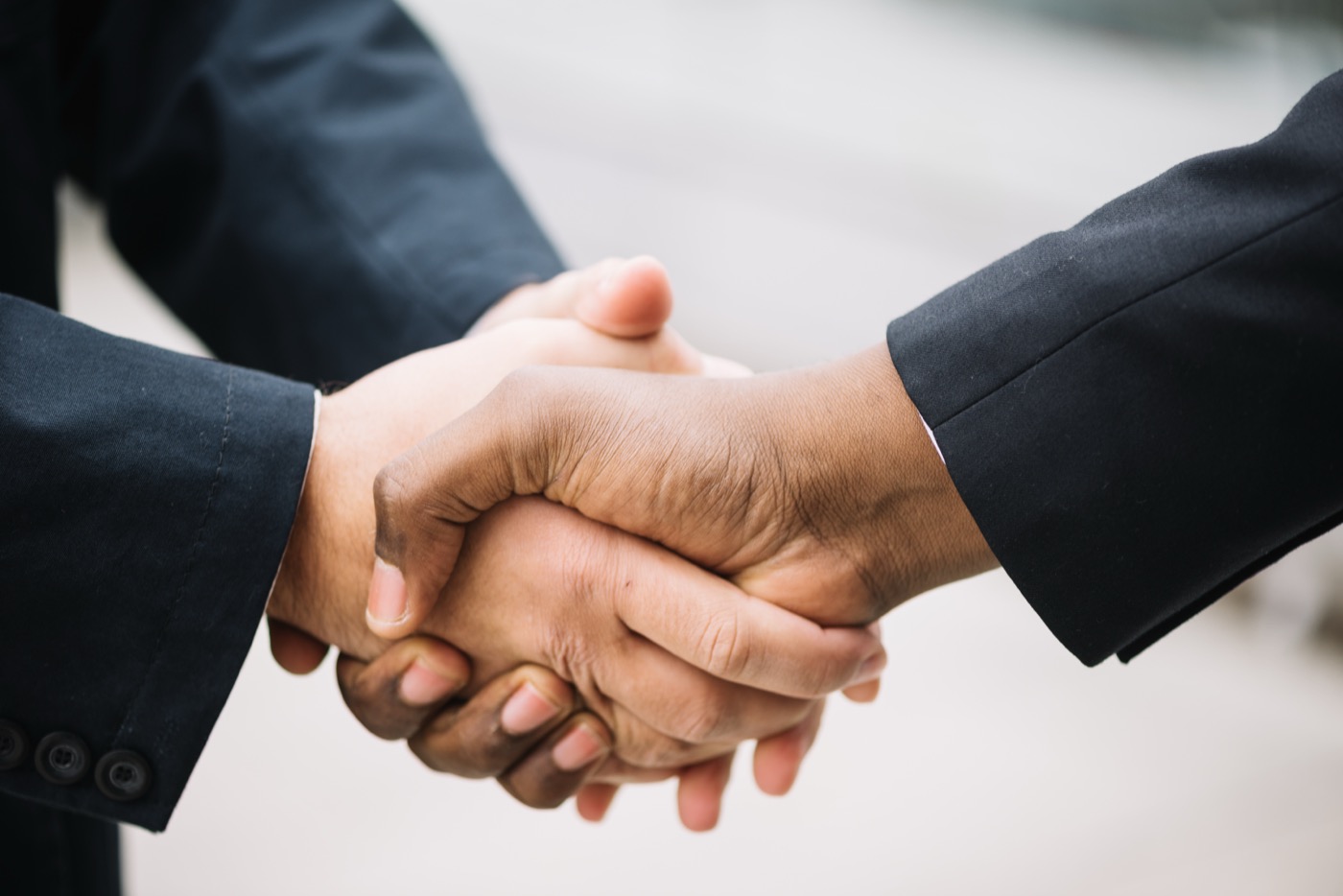 Two business people shaking hands