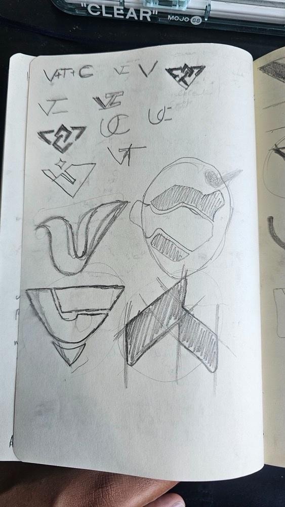 Sketchbook page of handshake and V logo sketches